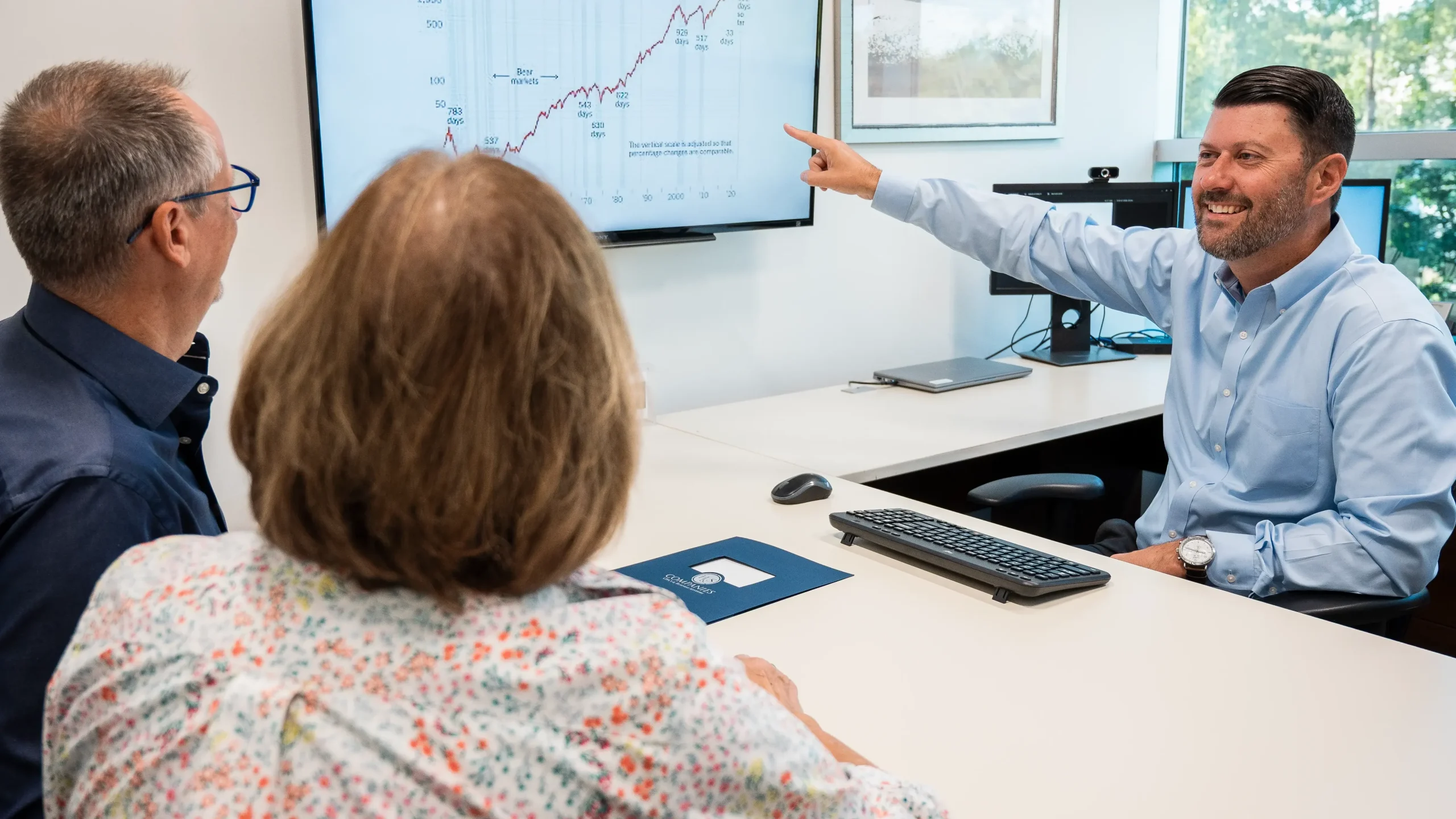 Couple speaking with advisor at H&S Companies